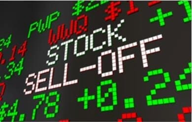 Een afbeelding van rode en groene koersen op schermen van de valutamarkt.